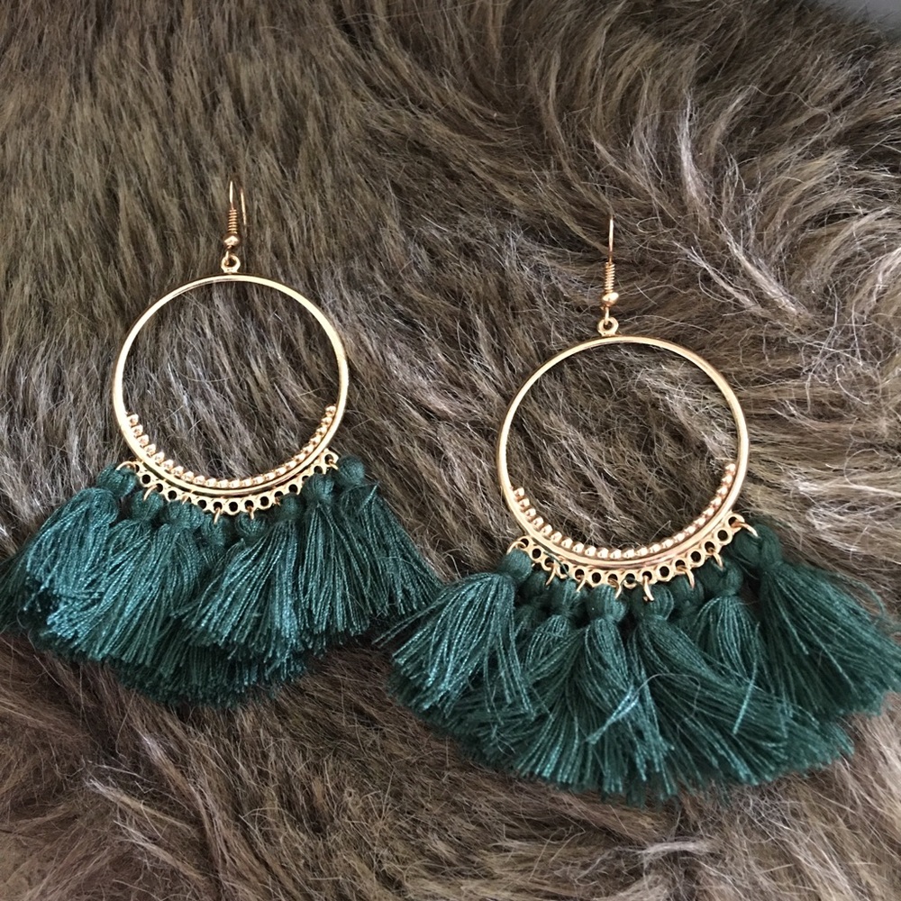 Gold tone fish hook green tassel earrings